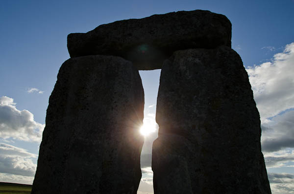 sun setting on stonehenge