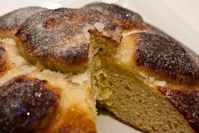 pan de muertos with a slice cut out