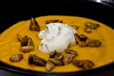 pumpkin soup with spiced pumpkin seeds and herbed creme fraiche