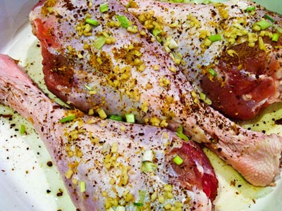 raw turkey legs with star anise, ginger, orange zest